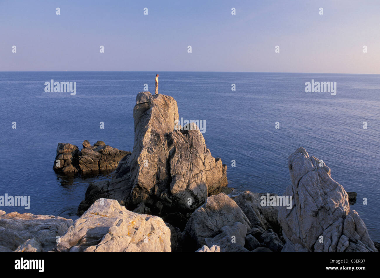 Man, standing, Rocky Coastline, near Le Croisic, Brittany, Bretagne, France, Europe, rocks Stock Photo