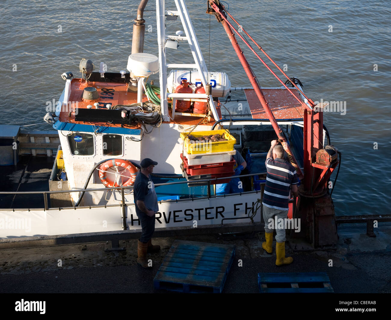 Fishing harbour unloading fresh catch Bridlington, Yorkshire, England Stock Photo Alamy