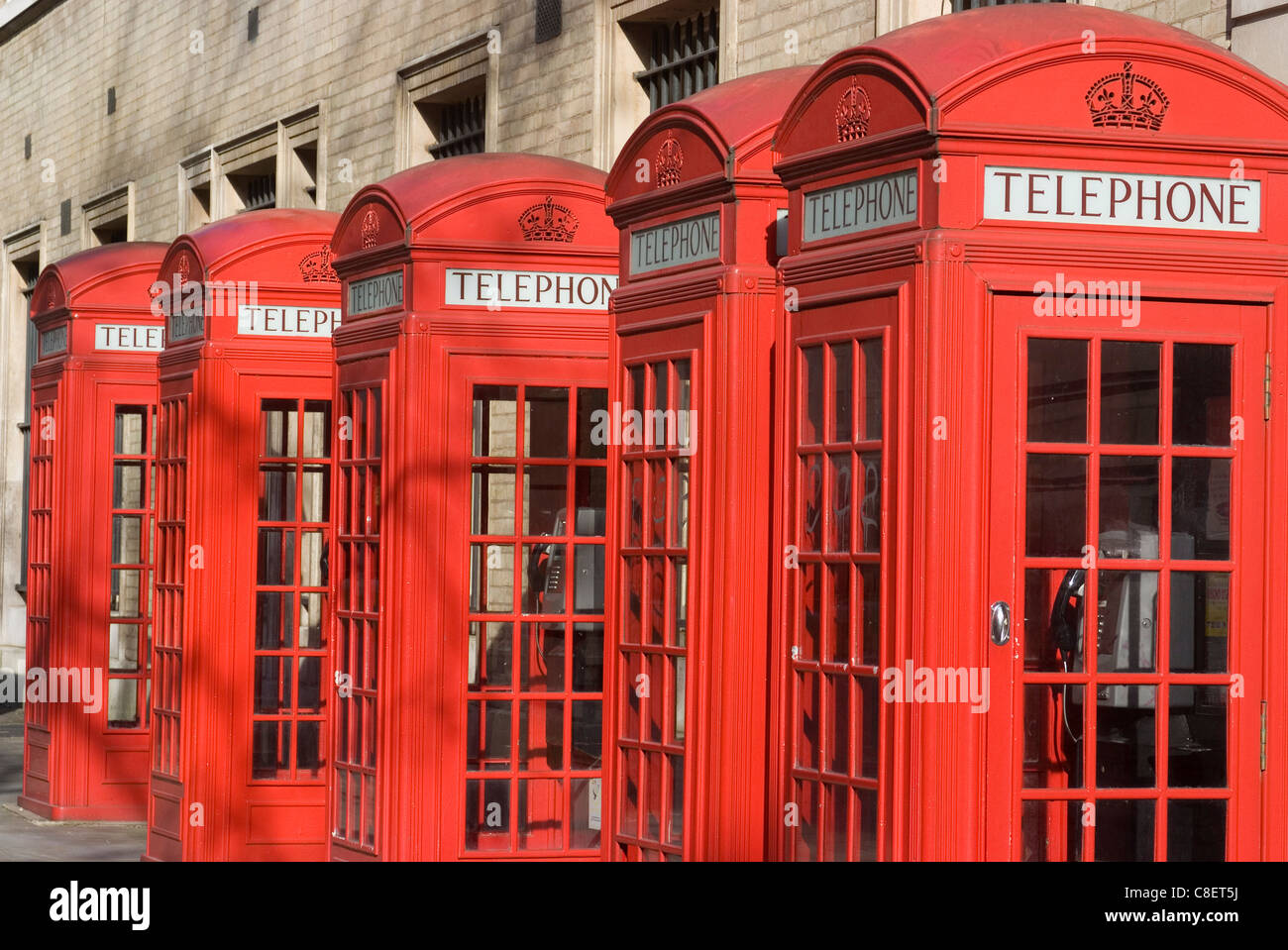 Row of old-fashioned red telephone boxes, Broad Court, near the Royal Opera House, Covent Garden, London, England,UK Stock Photo