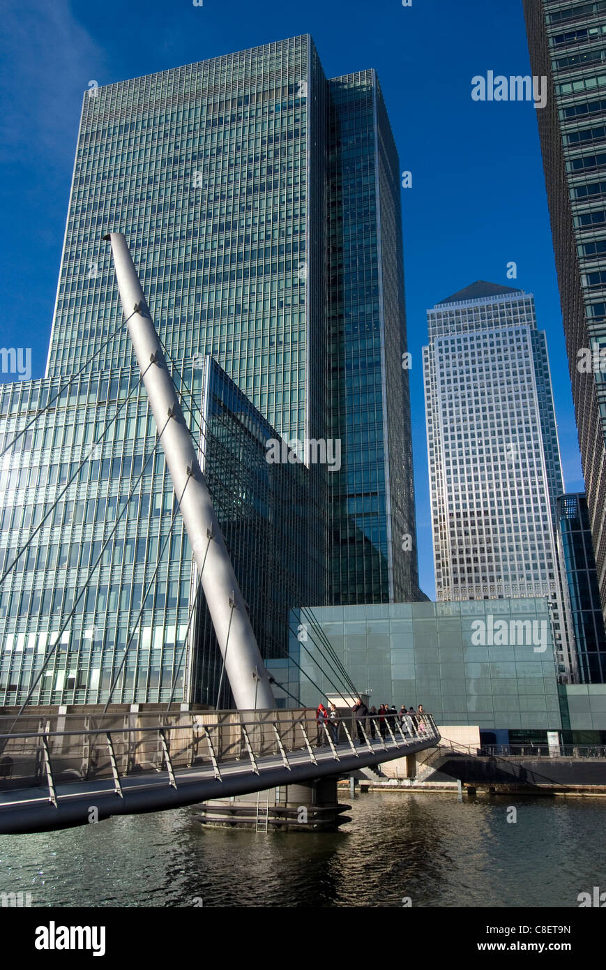 Looking over bridge towards Canary Wharf and towers, Docklands, London, England, United Kingdom Stock Photo