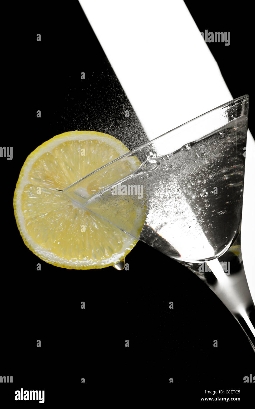 martini cocktail garnished with lemon Stock Photo Alamy