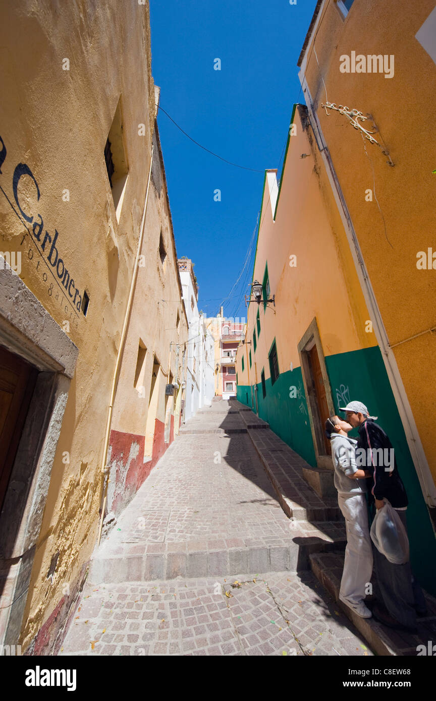 Couple kissing in an alley, Guanajuato, Guanajuato state, Mexico Stock Photo