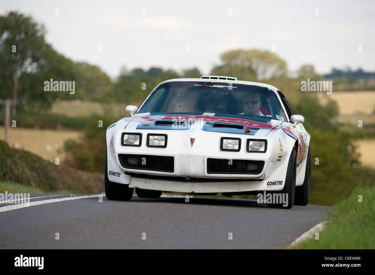 1970's Pontiac Firebird Trans Am car being driven on a road in England. Stock Photo