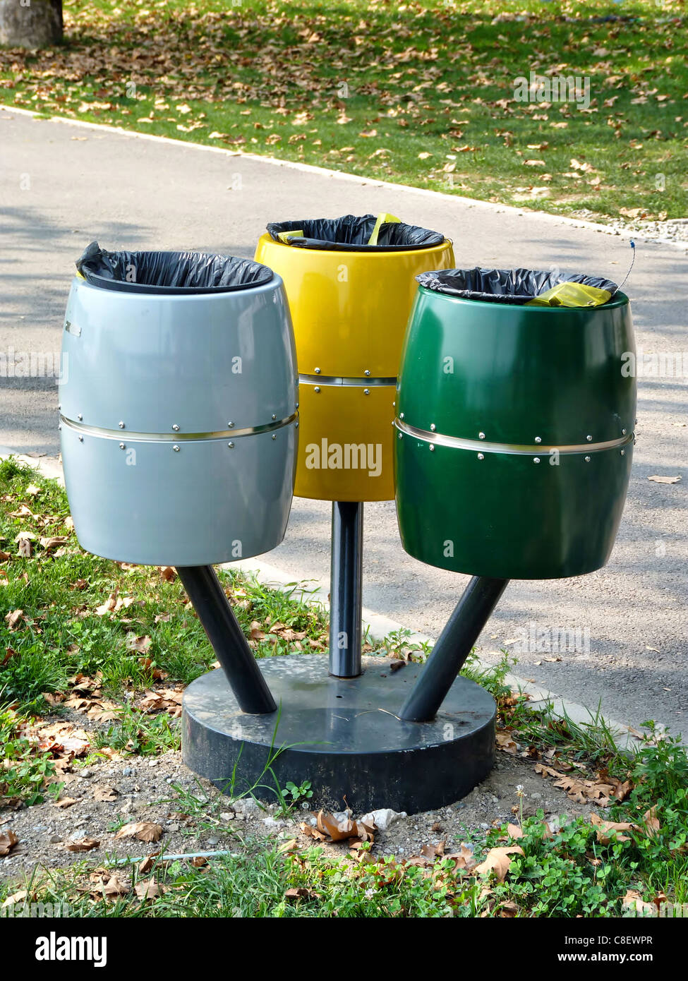 Colorful Recycle Bins In a Park Stock Photo - Alamy