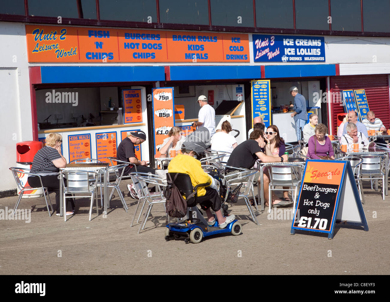 People sitting outside cafes Bridlington, Yorkshire, England Stock Photo