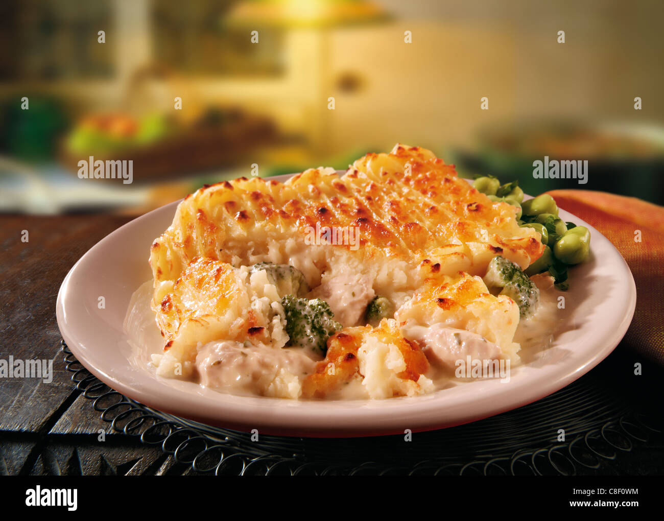 Traditional savory pie kurnik with chicken, potatoes and rice. Homemade  baking. Vertical view Stock Photo