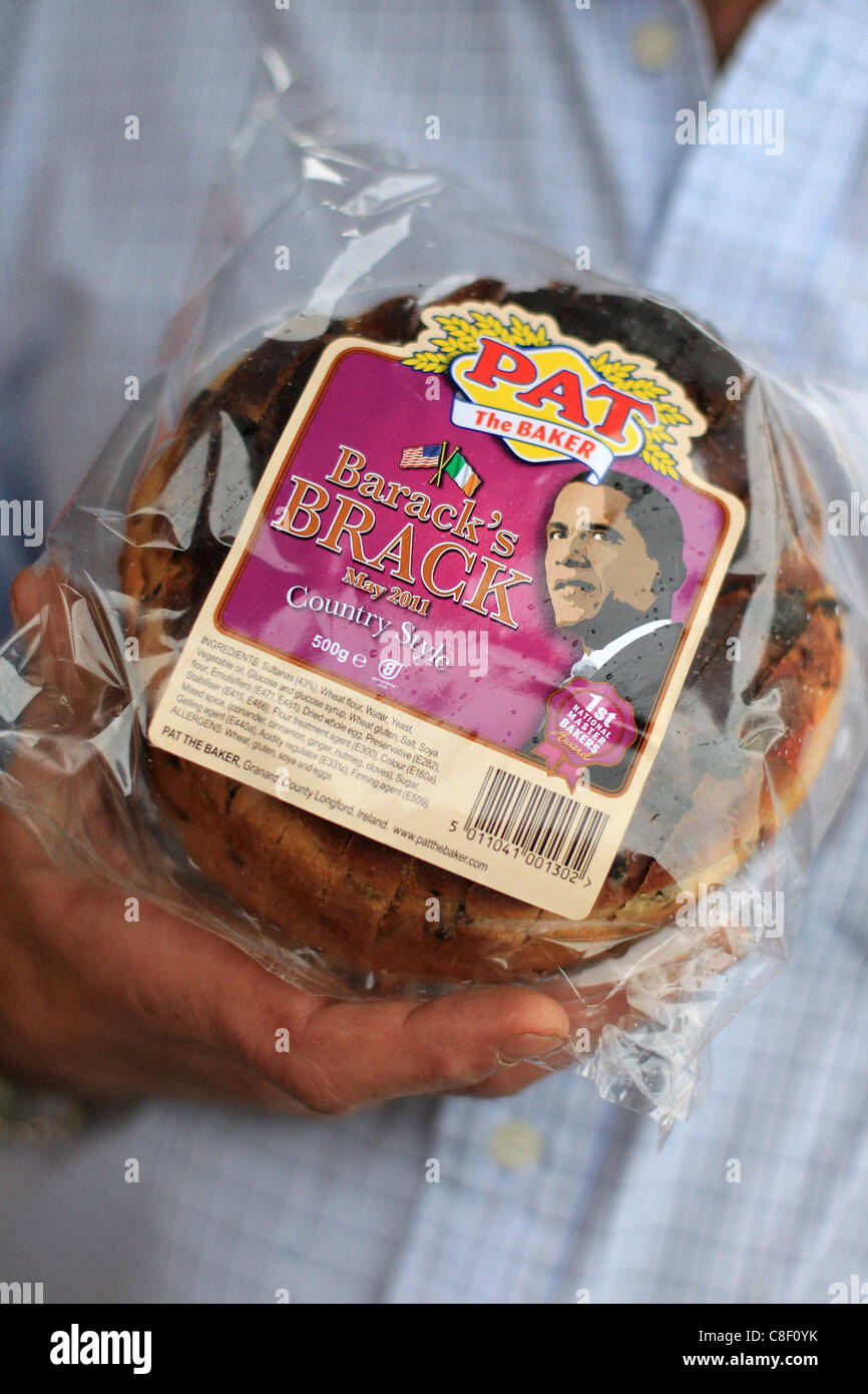 A local residents of Moneygall holds a 'Brack' of bread named after U.S. President Barack OBama in Moneygall, Ireland. Stock Photo