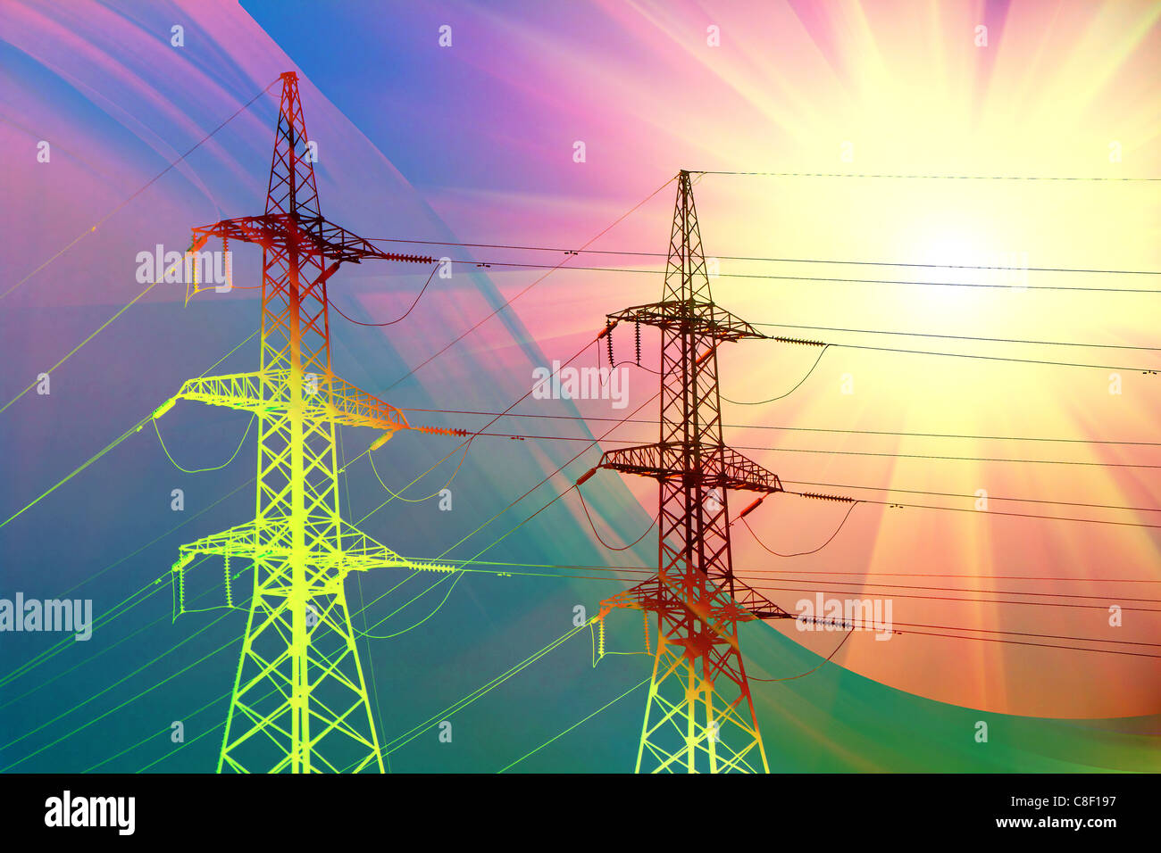 electric power transmission towers at sunset Stock Photo