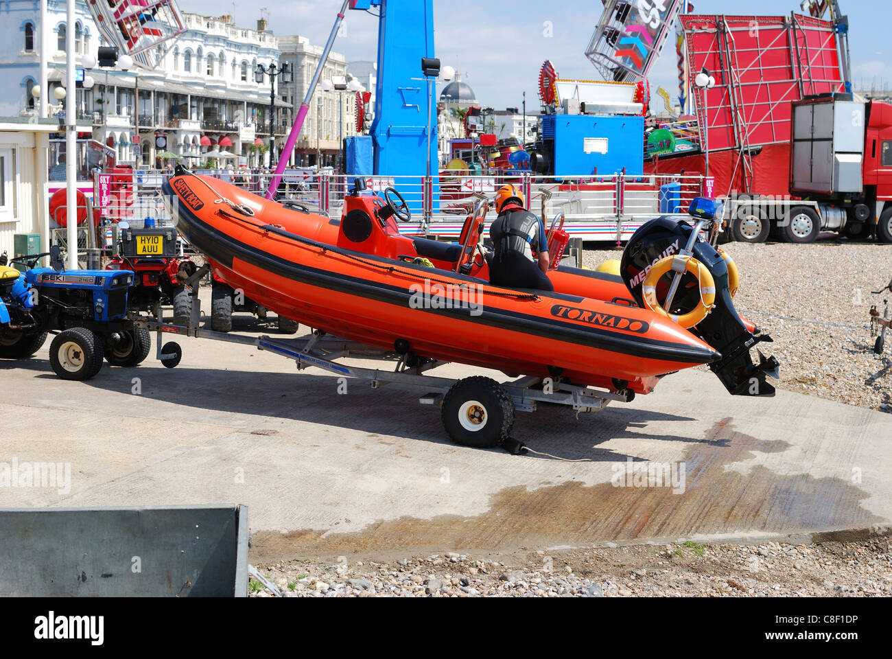 Inshore, inflatable RIB lifeboat on trailer at launch ramp on beach. Worthing. West Sussex
