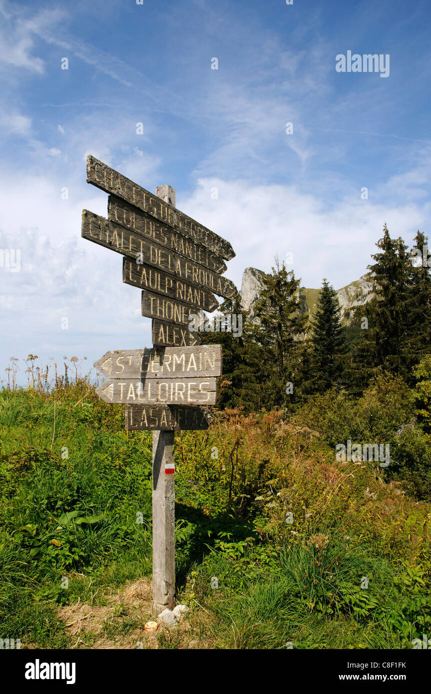 An old wooden signpost in the French Alps Stock Photo