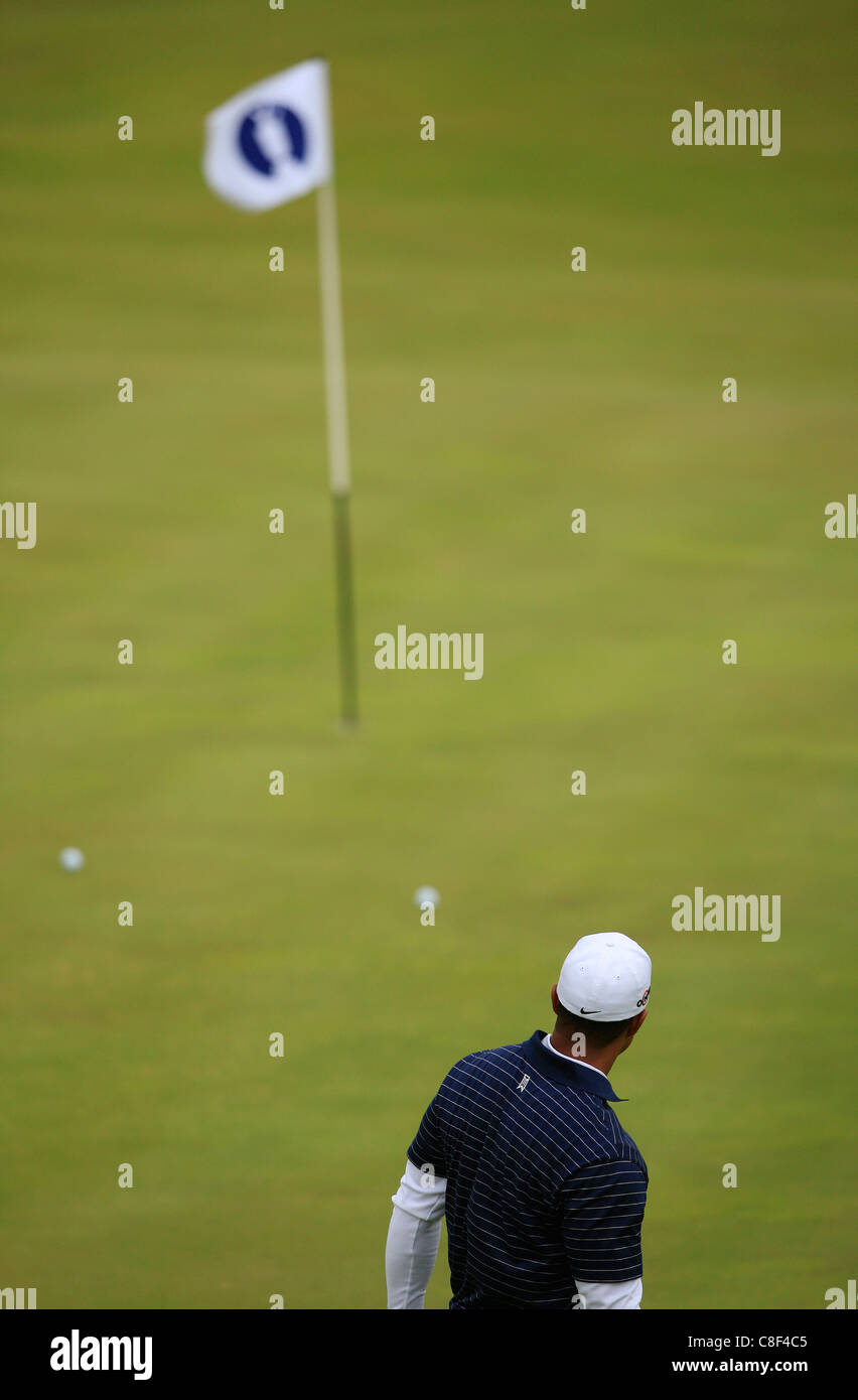 Tiger Woods watches his putt as he practices at the Open Stock Photo