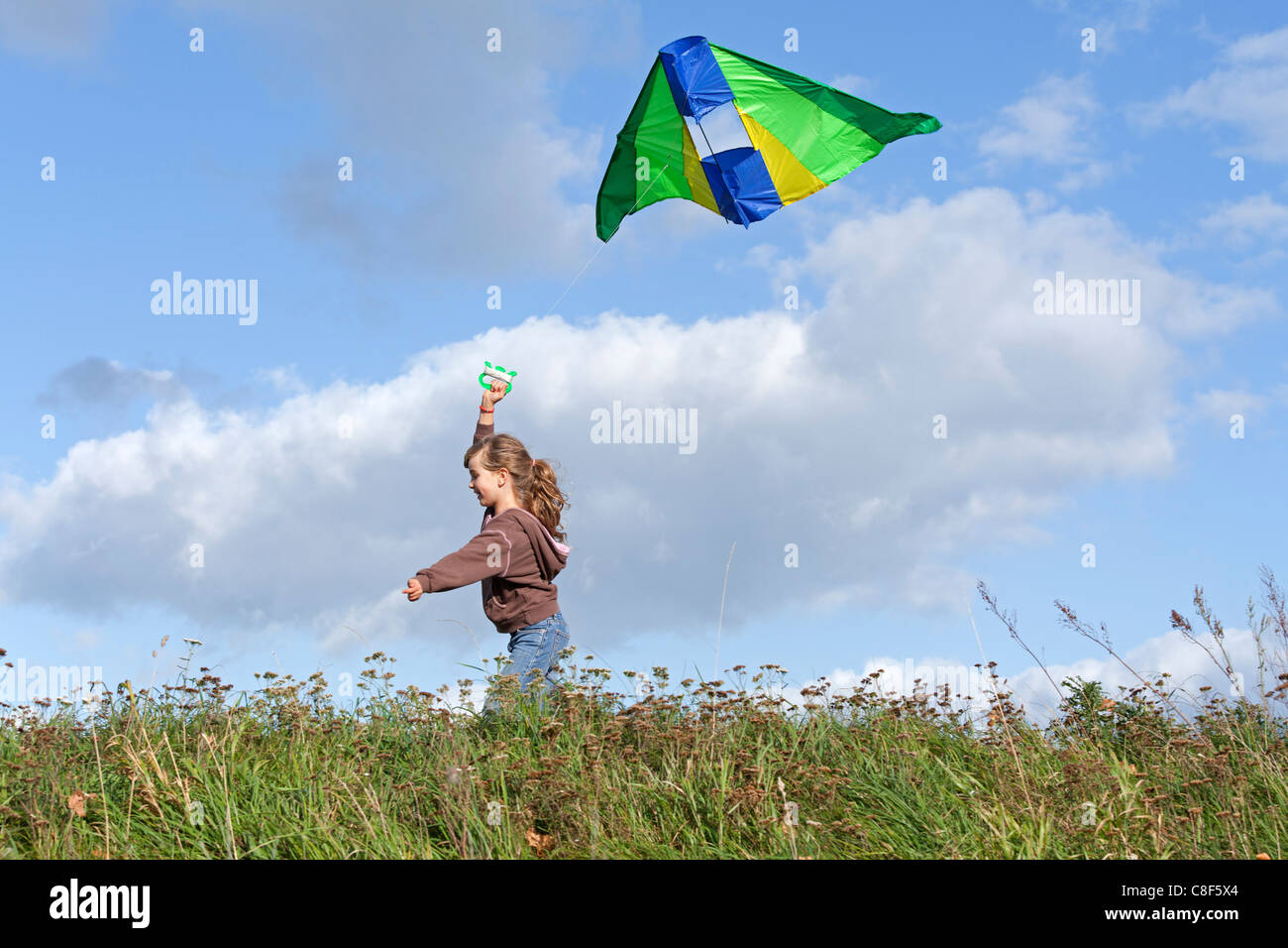 young girl flying a kite Stock Photo