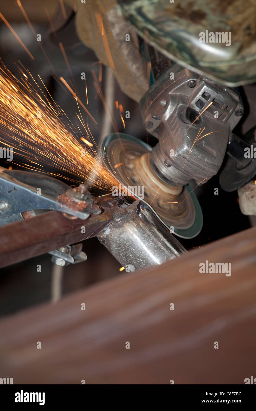 power tool grinding metal with sparks Stock Photo Alamy