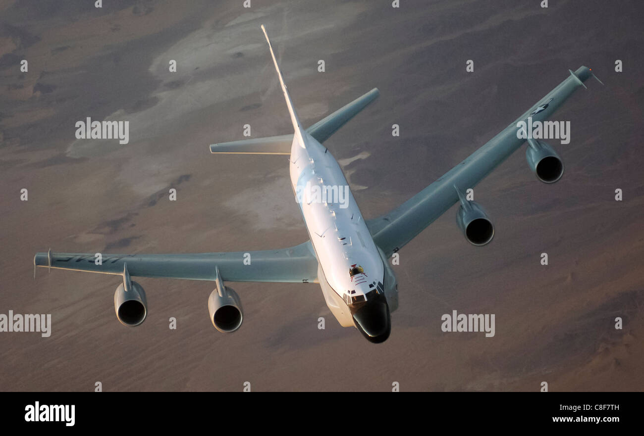 The RC-135 Rivet Joint, an intelligence and reconnaissance aircraft with a 34-member crew, conducts surveillance missions over Afghanistan, supporting long-term military operations and data collection in Southwest Asia. Stock Photo