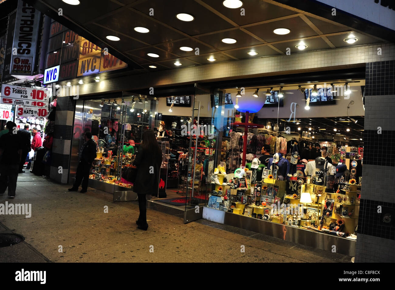 Nyc gifts tiles above white spotlight canopy sidewalk marquee hires
