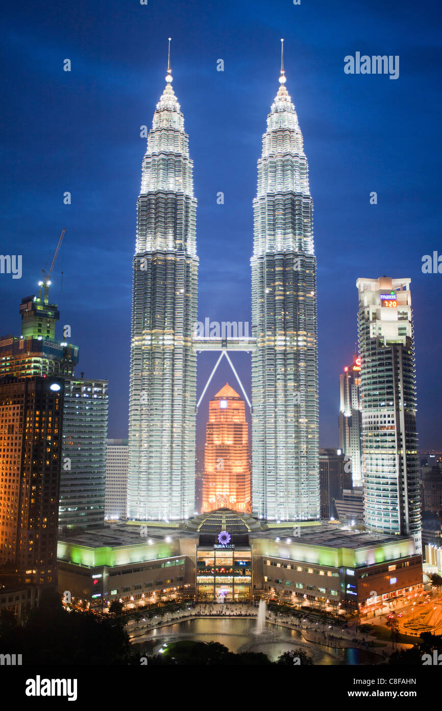 Malaysia, Asia, Kuala Lumpur, town, city, Petronas Towers, Skyline, park, trees, park, evening, lights, illumination, at night Stock Photo