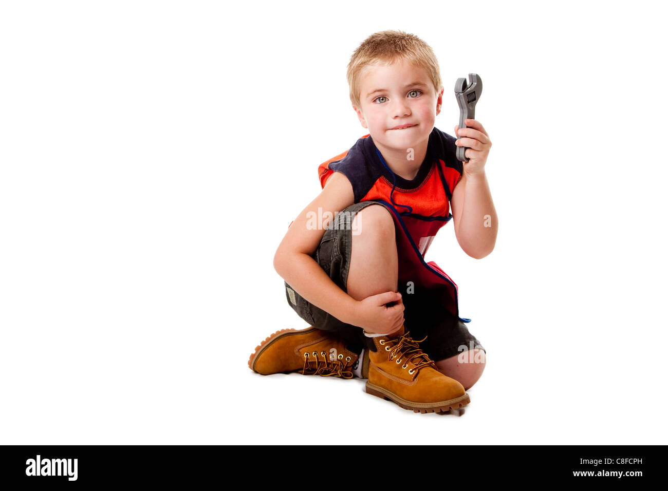 Boy with wrench Stock Photo