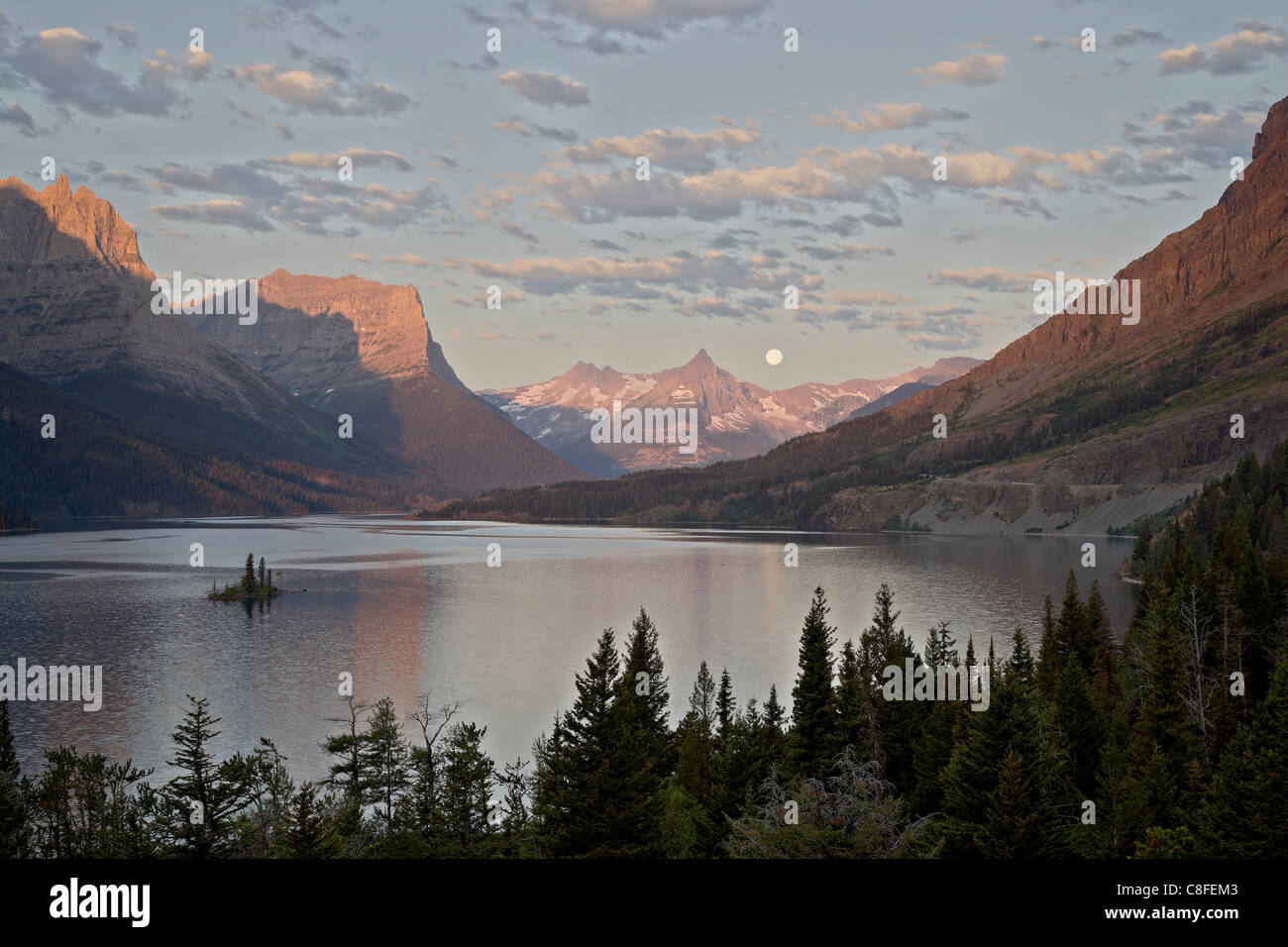 Moonset over St. Mary Lake, Glacier National Park, Montana, United States of America Stock Photo