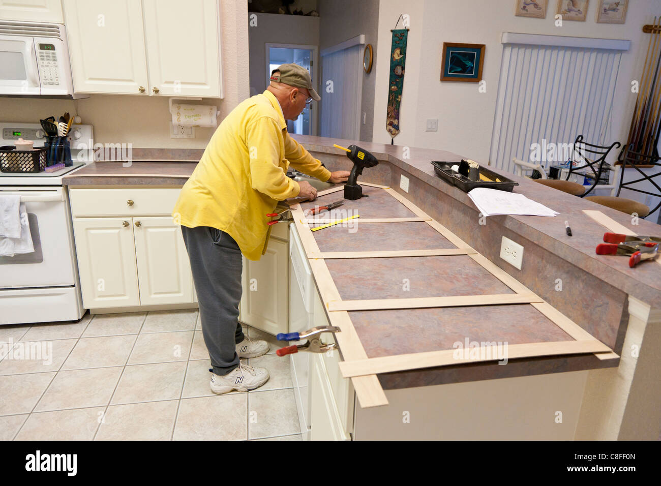 Man Builds A Wooden Template For Use In Making New Granite Counter
