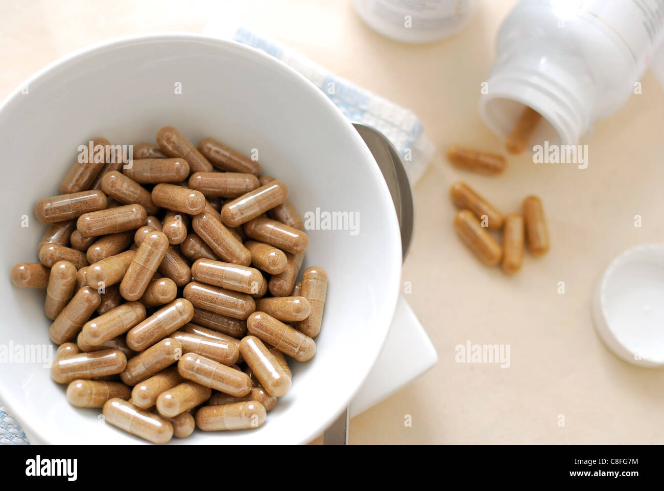 White bowl filled with medicine capsules Stock Photo Alamy