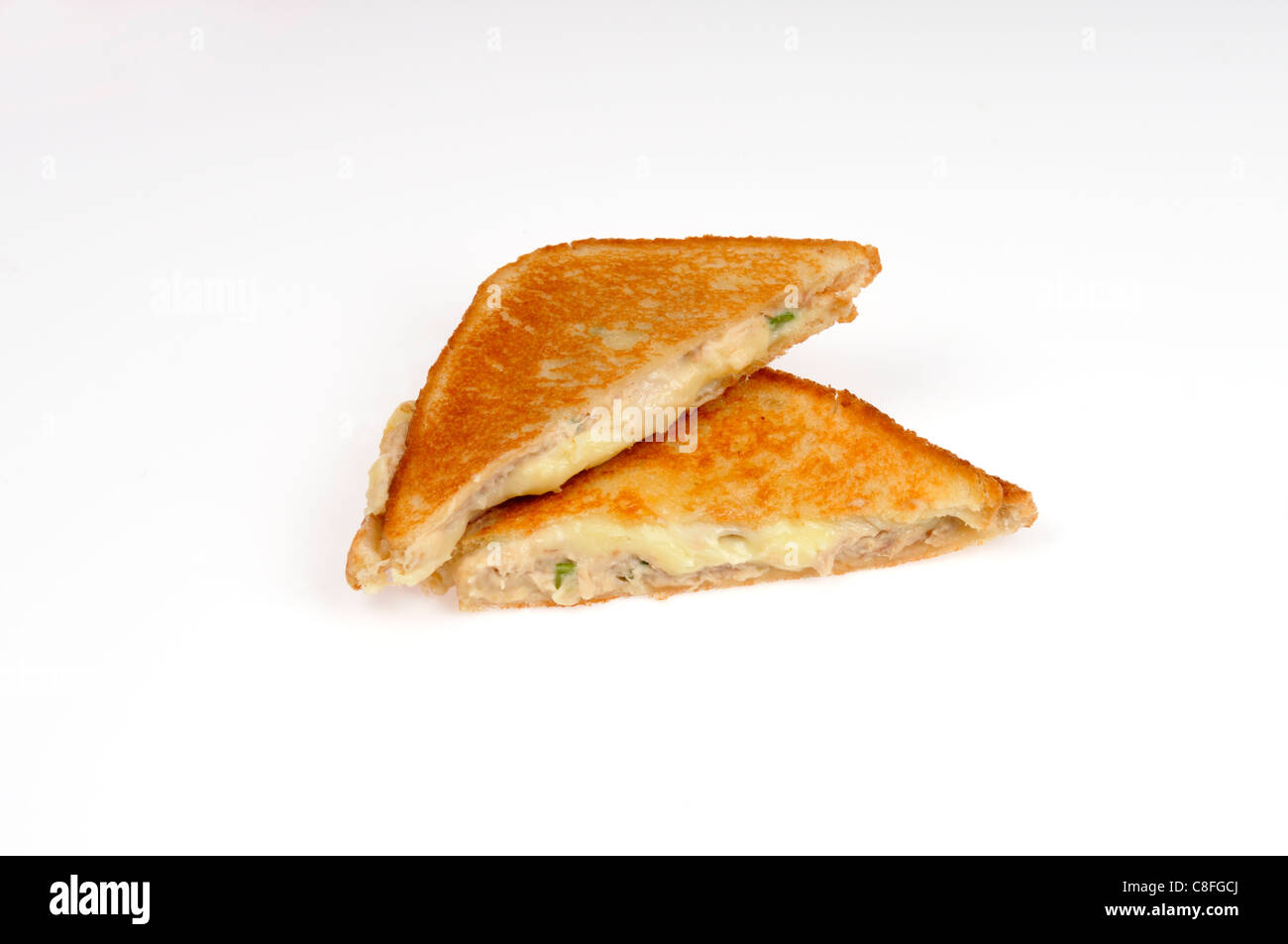 Toasted tuna melt grilled cheese sandwich on white background cut out. Stock Photo