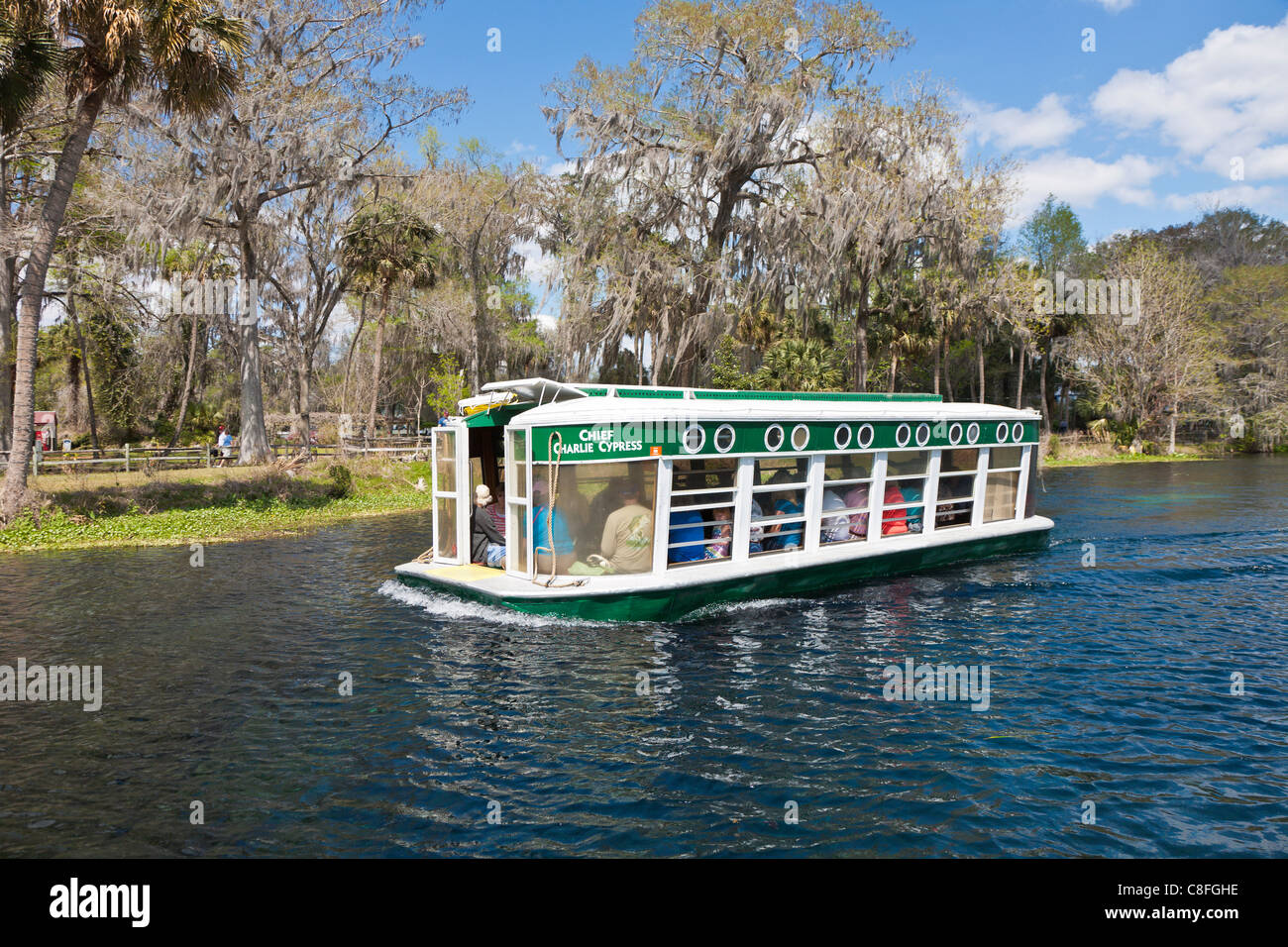 Park guests take glass bottom boat tour of the Silver River at Silver