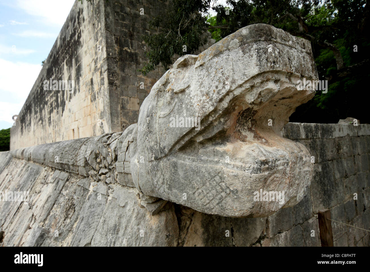 Massive stone carving of snake head, Chichen Itza, UNESCO World Heritage Site, Yucatan, Mexico Stock Photo