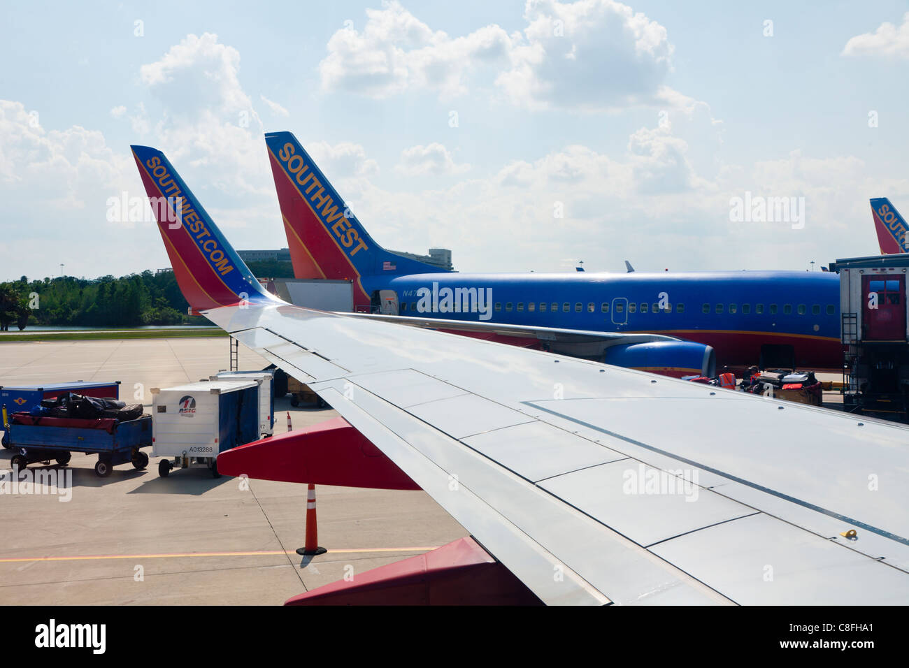 Southwest jet aircraft at gates in Orlando International Airport in Orlando, Florida Stock Photo
