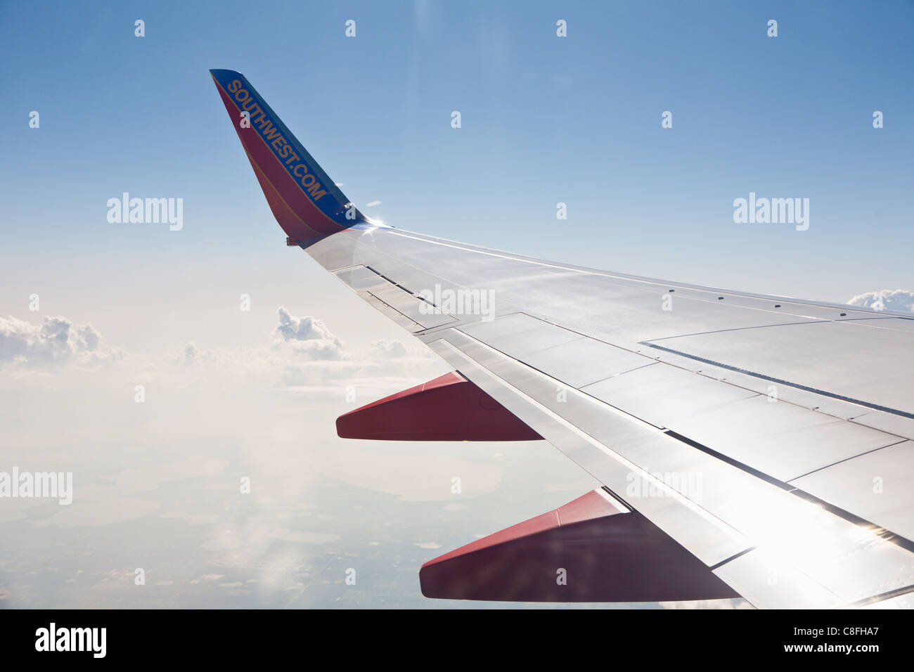Southwest jet wing in cloudy sky over rural area near Columbus, Ohio Stock Photo