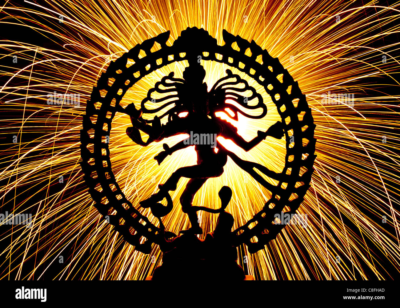 Dancing lord Shiva statue, Nataraja, in front of fireworks sparks ...