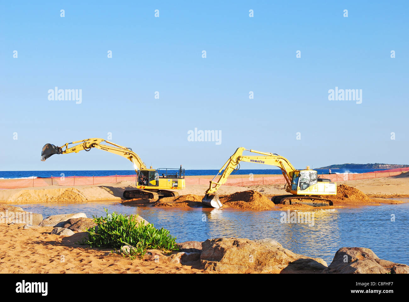 2 tracked excavators dredging sand Stock Photo