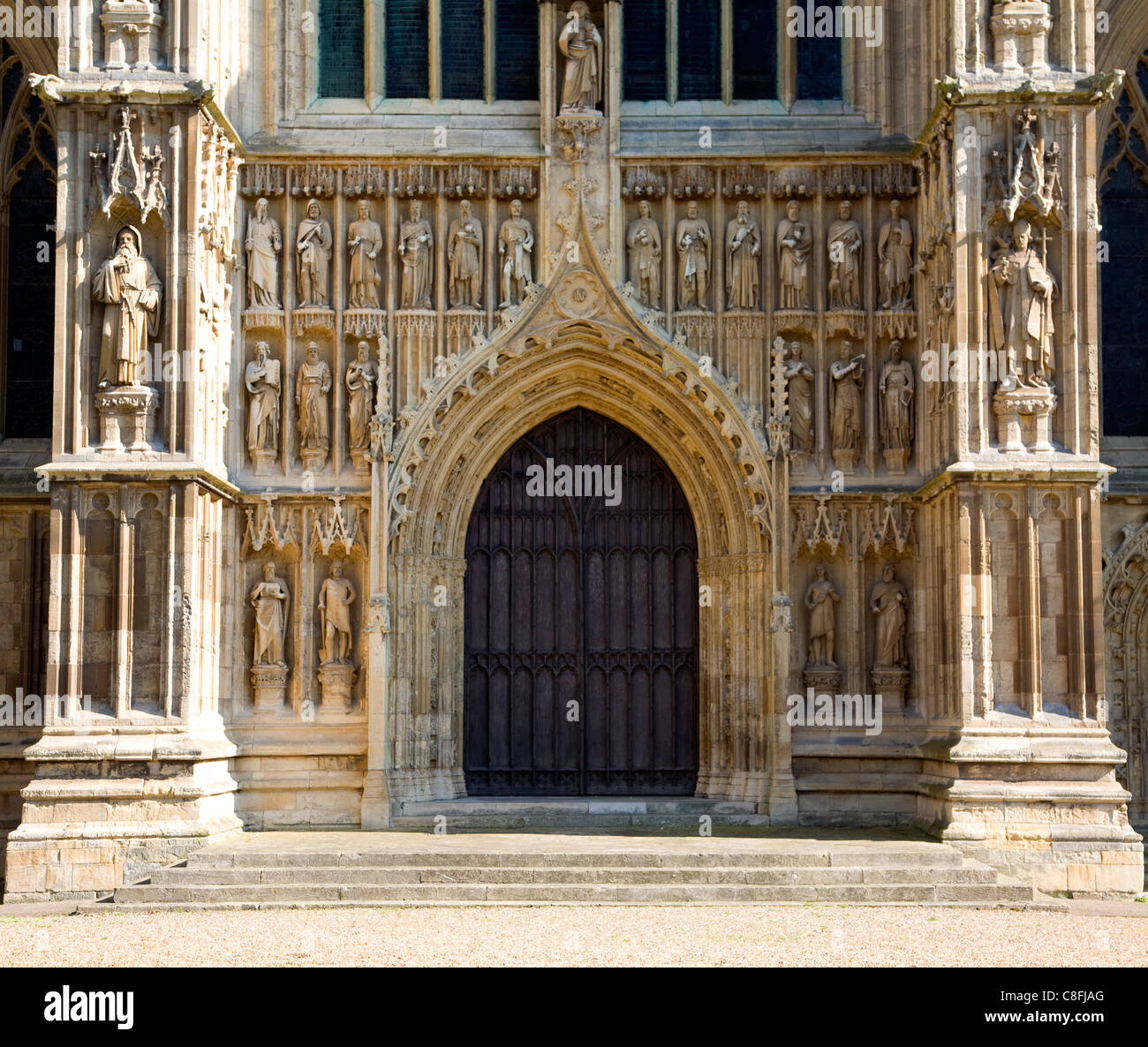 Stone statues around wooden doors Beverley minster, Yorkshire, England