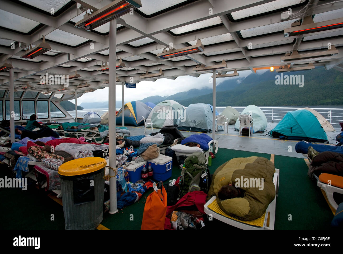 Passenger sleeping in the solarium. Columbia ferry. Alaska Inside
