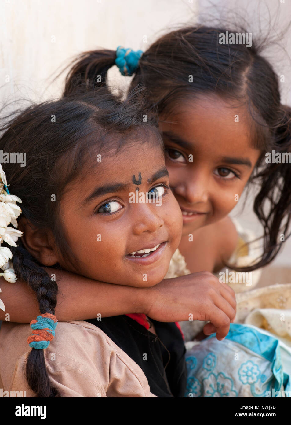 Young poor lower caste Indian street girls smiling. Andhra Pradesh, India Stock Photo