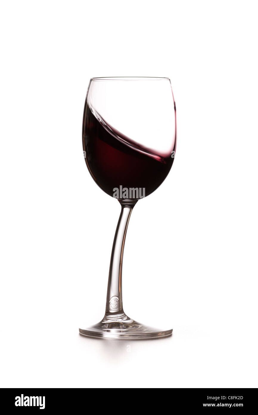 Red wine sloshing in a glass Stock Photo