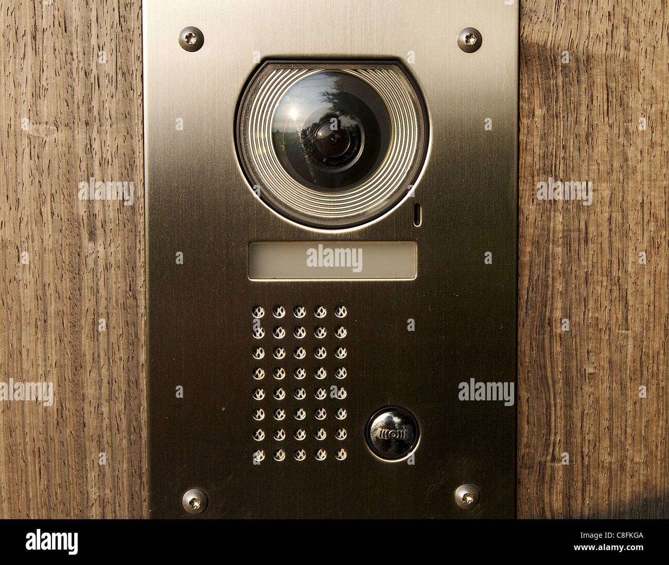 Intercom With Camera On Wooden Front Door Stock Photo