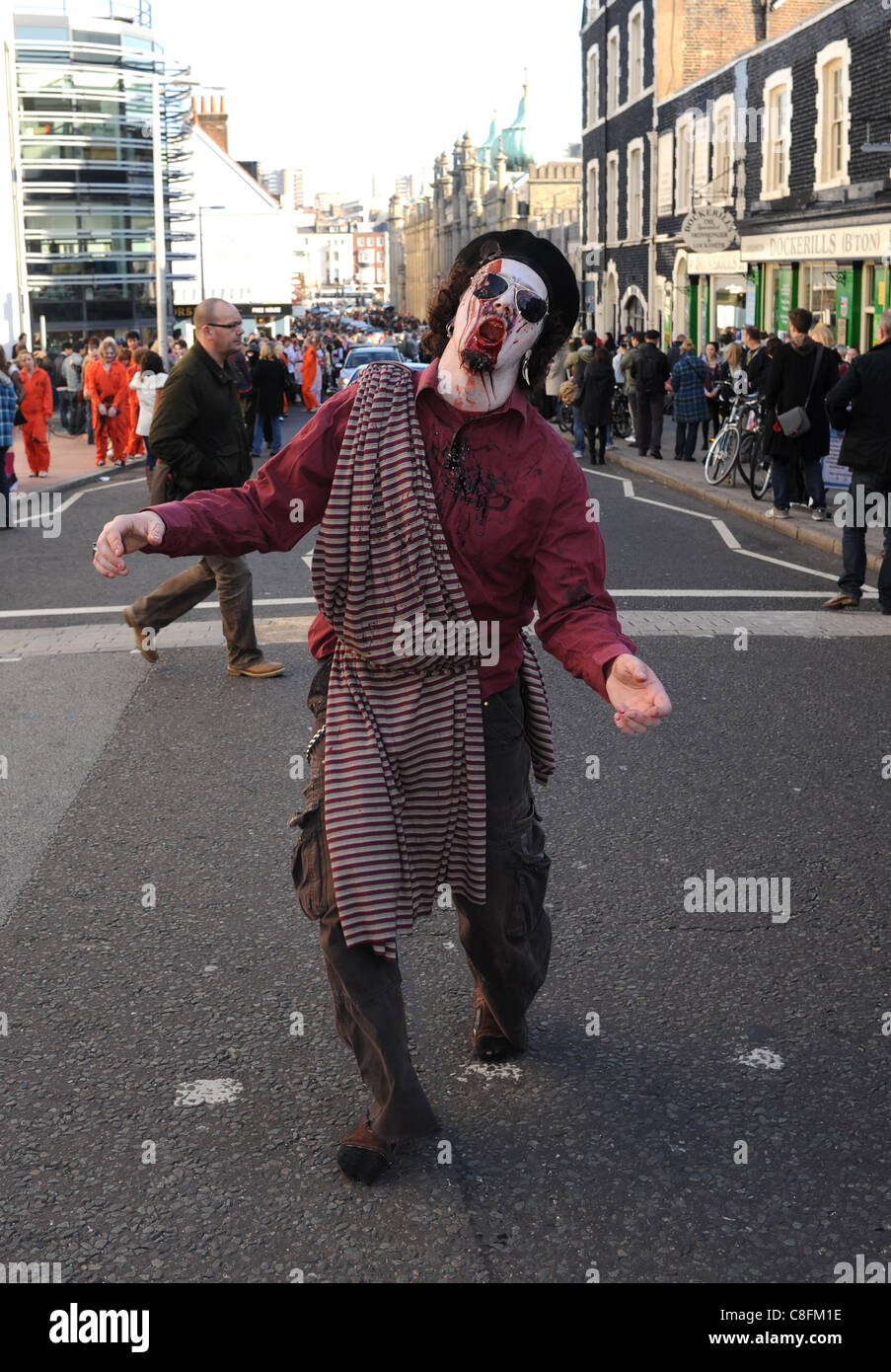A Colonel Gaddafi lookalike takes part in the Beach of The Dead Zombie Walk through Brighton city centre today . Stock Photo
