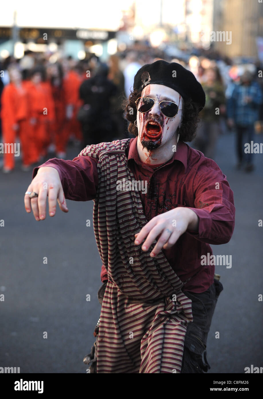 A Colonel Gaddafi lookalike takes part in the Beach of The Dead Zombie Walk through Brighton city centre today . Stock Photo