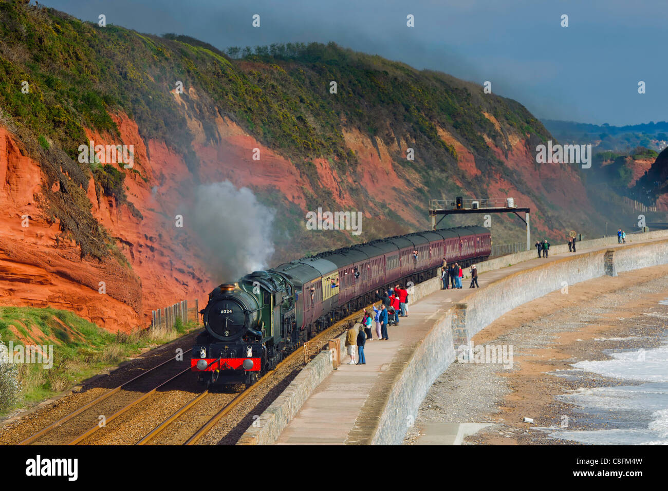 The Devonian double headed by steam locomotives 6024 King Edward I and 70013 Oliver Cromwell approaches Dawlish south Devon UK Stock Photo