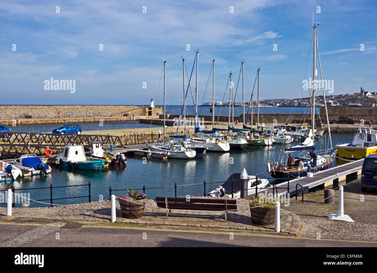 View over Banff marina harbour with moored  leisure vessels and to Macduff across the mouth of River Deveron Stock Photo