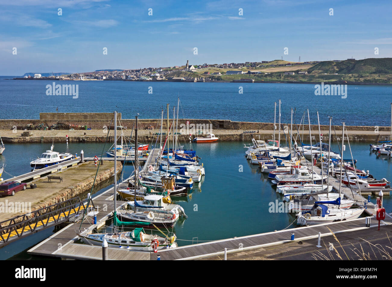 View over Banff marina harbour with moored  leisure vessels and to Macduff across the mouth of River Deveron Stock Photo