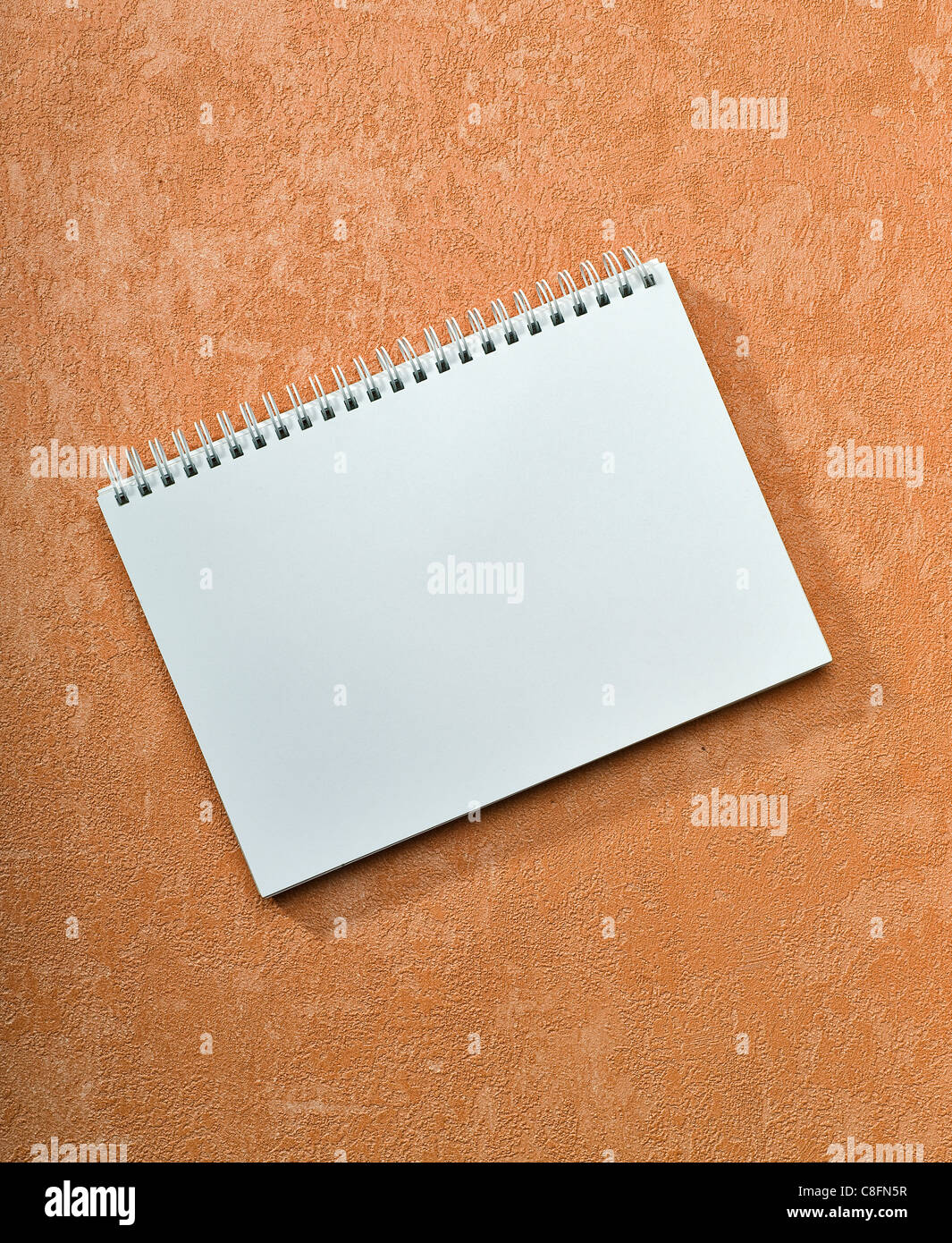 spiral notebook on painted background Stock Photo - Alamy