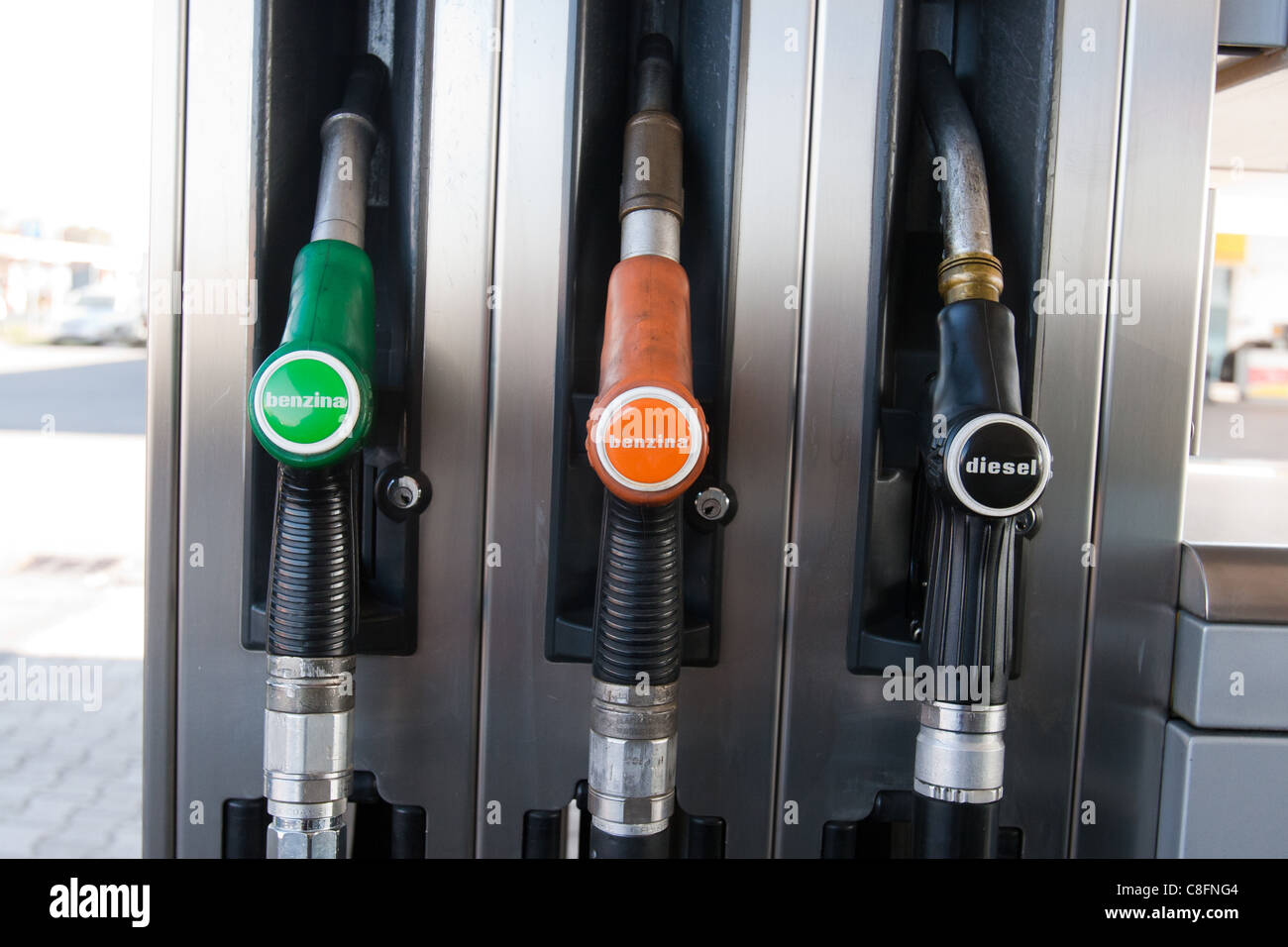 Petrol oil gas pump nozzles at a service station close up Italy Stock Photo