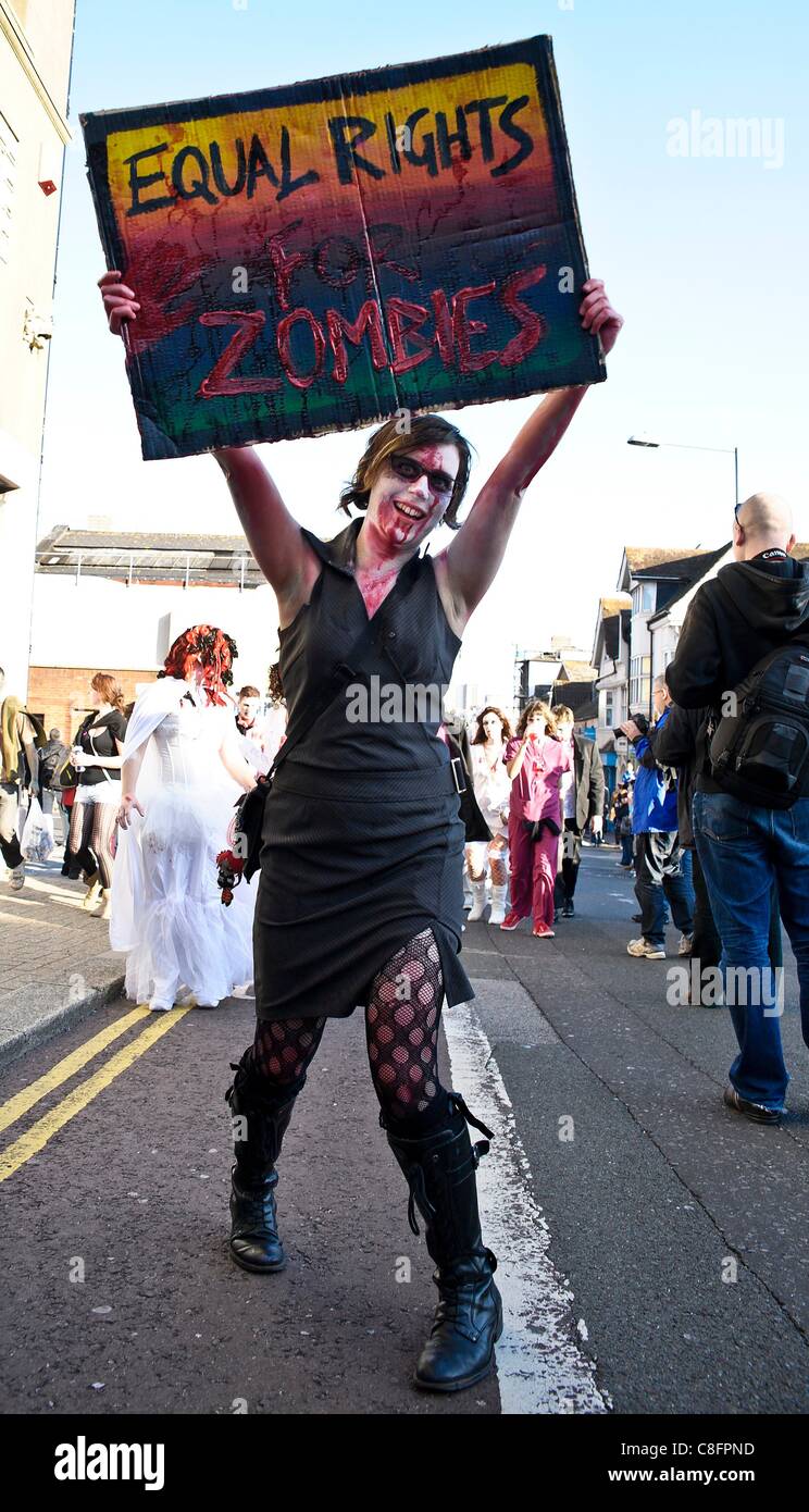 Thousands of Zombies gathered in Brighton on 22nd October 2011 for Beach of the Dead V - The Brighton Zombie Parade 2011. The parade started in Victoria Gardens, walked through the shopping area and along the seafront passing the new Brighton Eye big wheel. Stock Photo