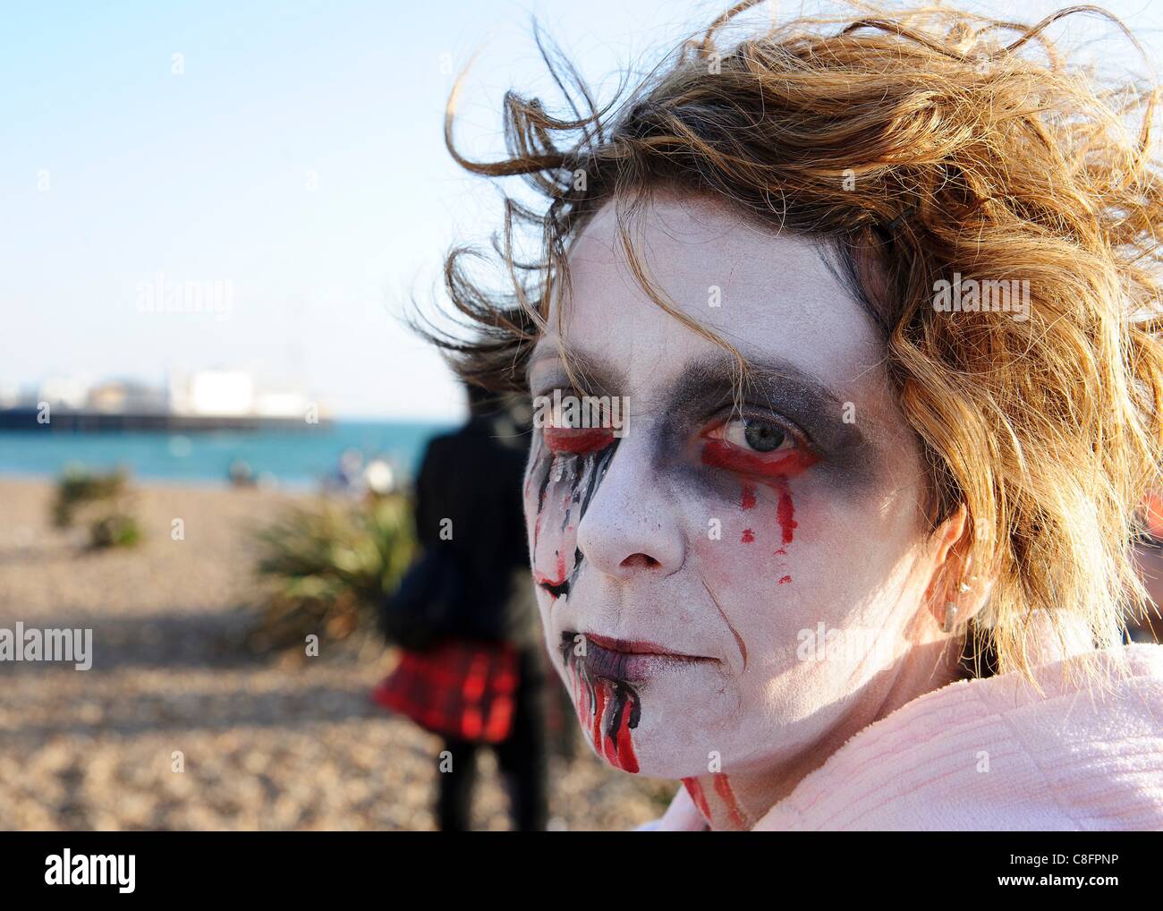 Thousands of Zombies gathered in Brighton on 22nd October 2011 for Beach of the Dead V - The Brighton Zombie Parade 2011. The parade started in Victoria Gardens, walked through the shopping area and along the seafront passing the new Brighton Eye big wheel. Stock Photo