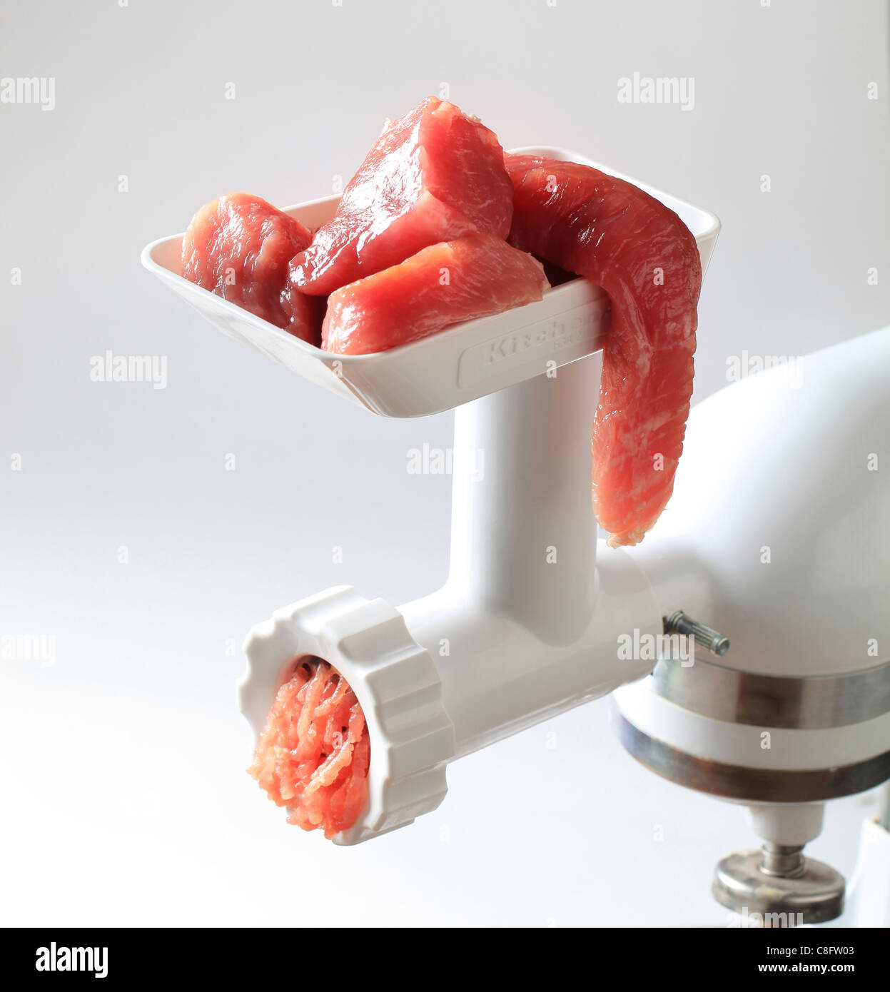 https://c8.alamy.com/comp/C8FW03/fresh-minced-meat-coming-out-of-a-meat-grinder-C8FW03.jpg