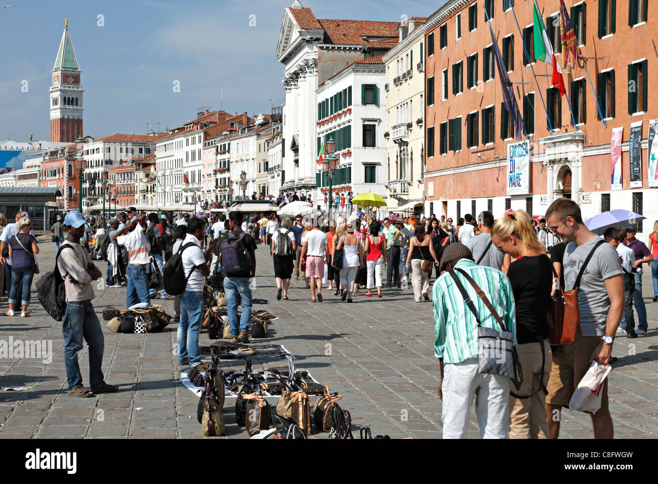 Bag sellers on the bank of the Piazza San Marco Square, Venice Italy