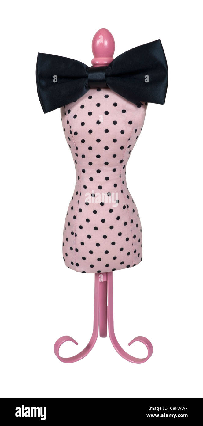 Pink dress form used for dressmaking and merchandising with a black bow