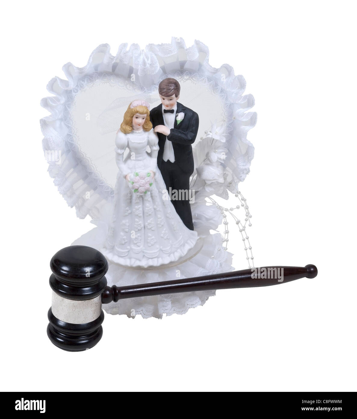 Wedding cake topper with lace and bride and groom with a wooden gavel ...