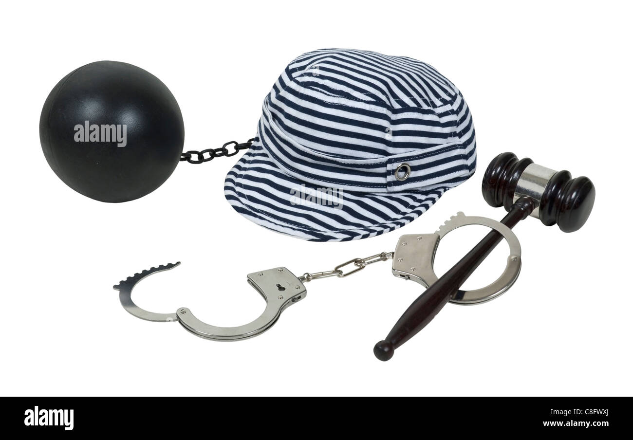 Laws and consequences shown by a gavel and handcuffs with a jailbird hat and ball and chain - path included Stock Photo